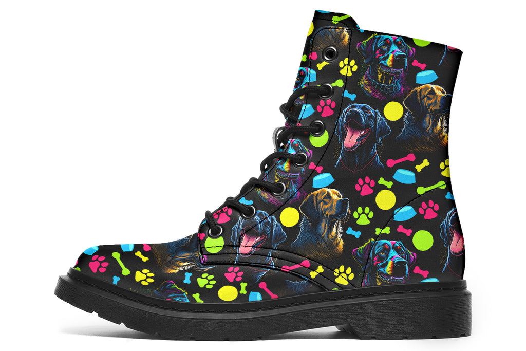 Black boots with a repetitive pattern of dog faces and neon paw prints, dog bowls and dog bones.