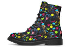 Black boots with a repetitive pattern of dog faces and neon paw prints, dog bowls and dog bones.