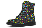 Black boots with a repetitive pattern of dog faces and neon paw prints, dog bowls and dog bones.
