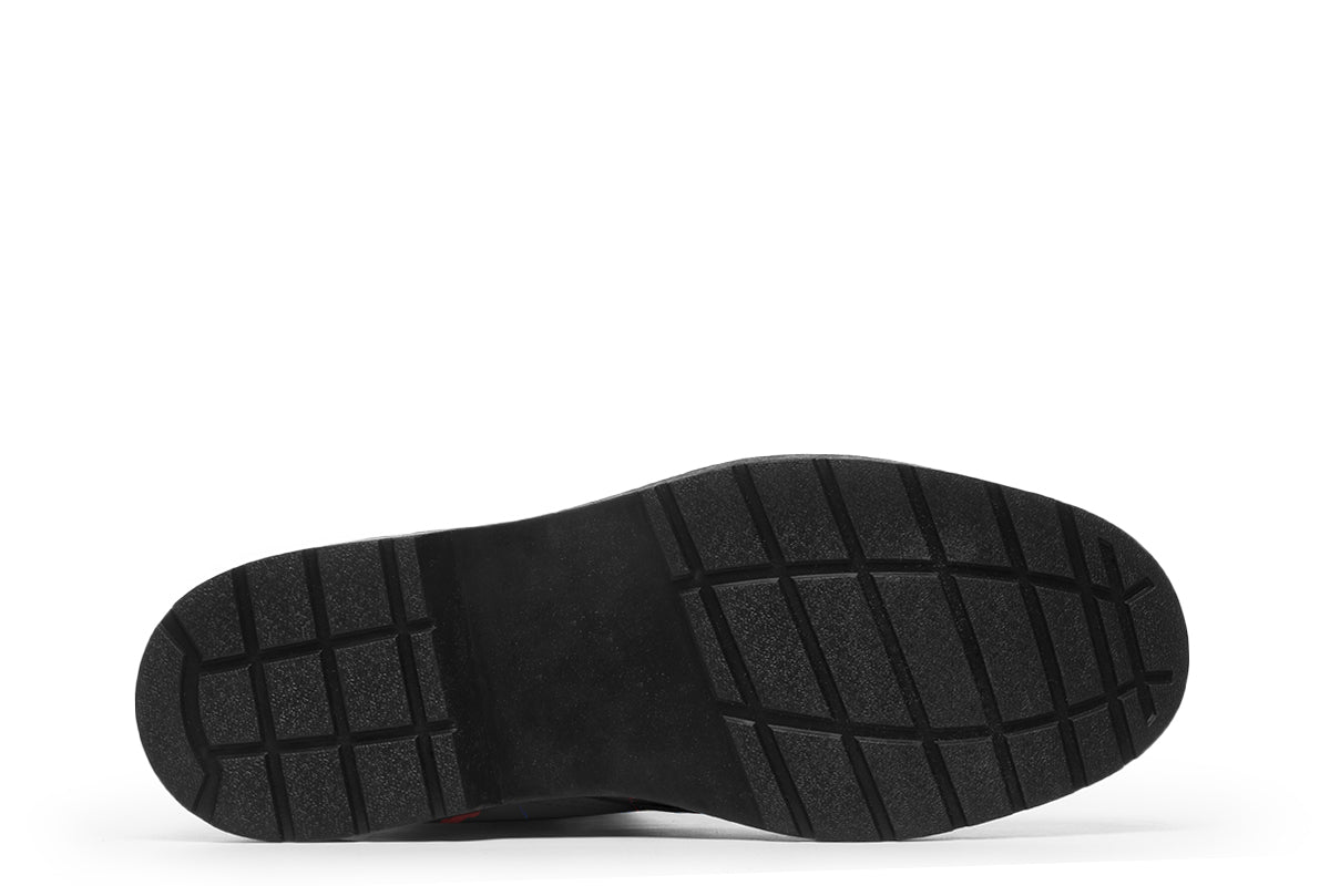 Black boots with a repetitive pattern of dog faces and neon paw prints, dog bowls and dog bones.