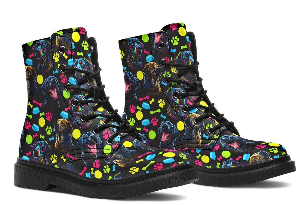 Black boots with a repetitive pattern of dog faces and neon paw prints, dog bowls and dog bones.