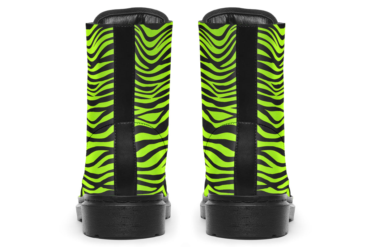 Boots featuring a zebra print in black and neon green