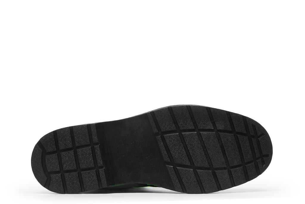 Boots featuring a zebra print in black and neon green