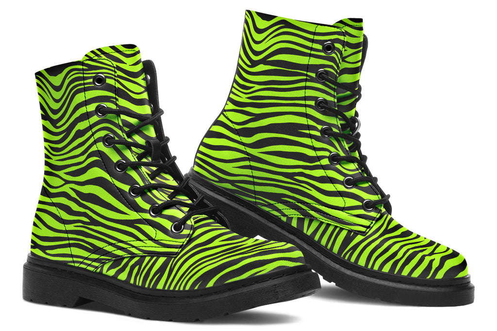 Boots featuring a zebra print in black and neon green