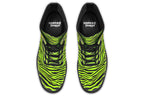 Boots featuring a zebra print in black and neon green