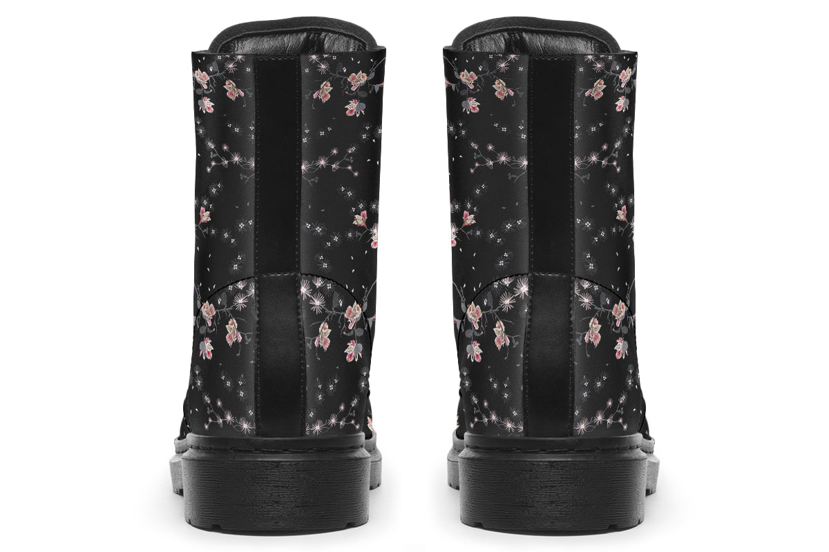 Black boots with a white floral pattern