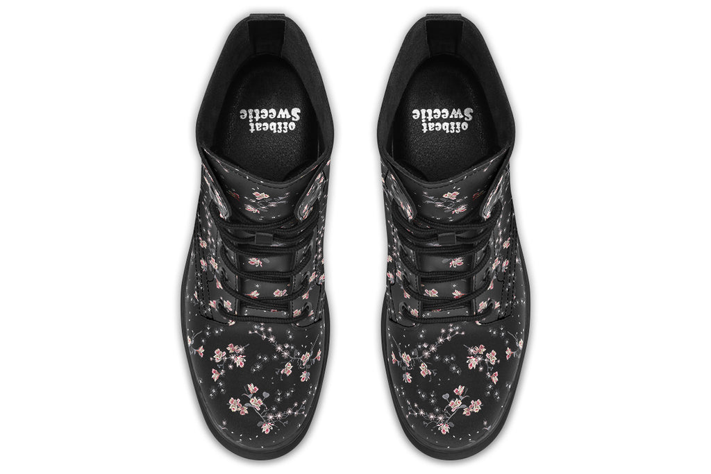 Black boots with a white floral pattern