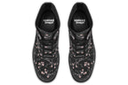 Black boots with a white floral pattern