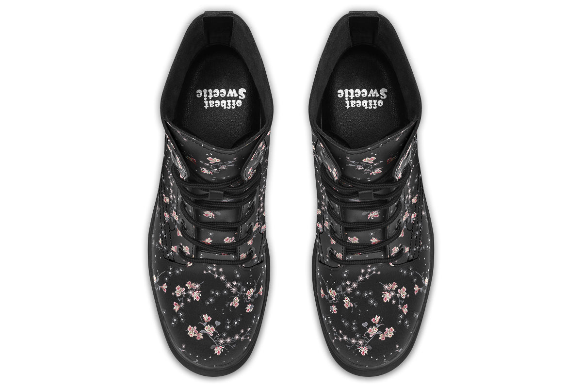 Black boots with a white floral pattern