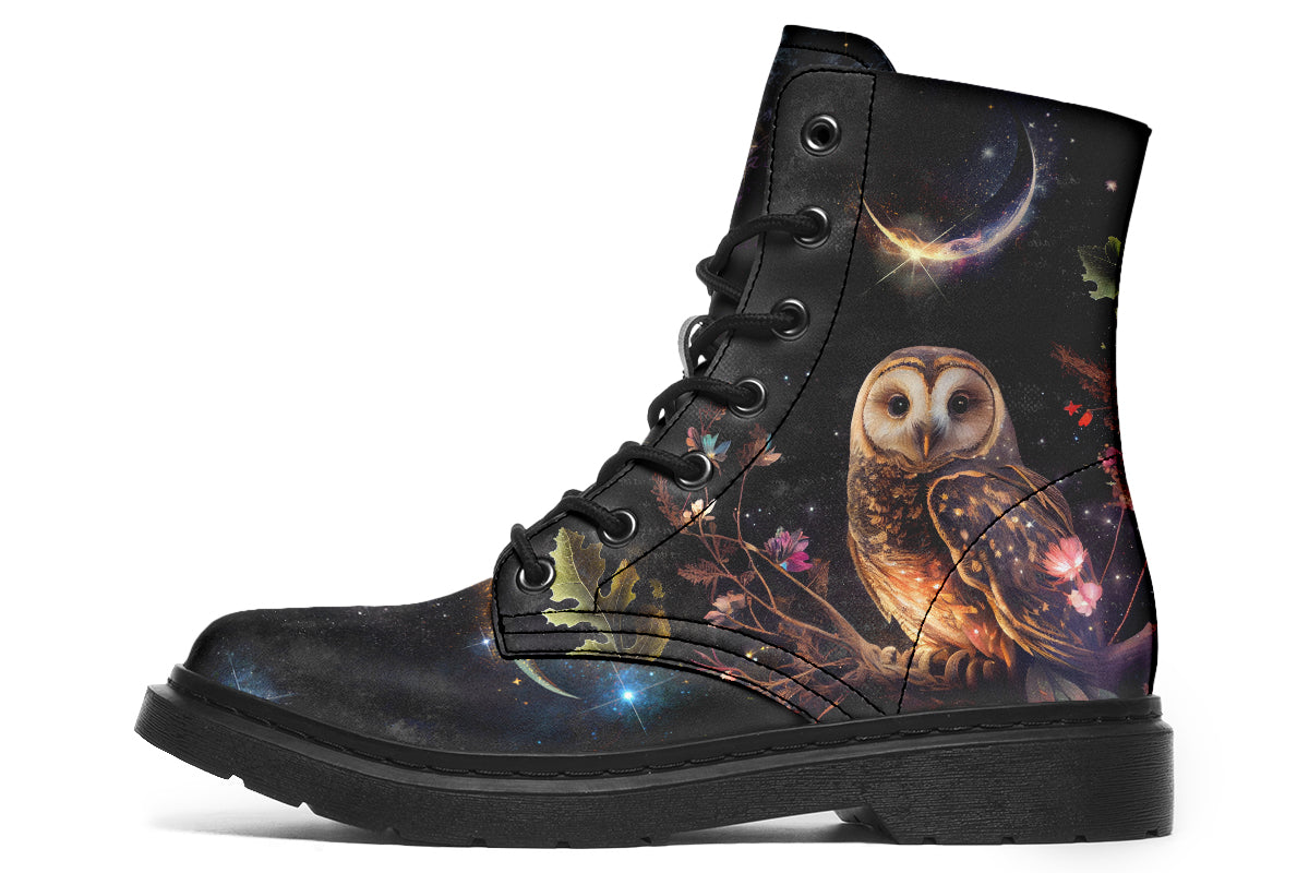 Black boots with different owls on each side.