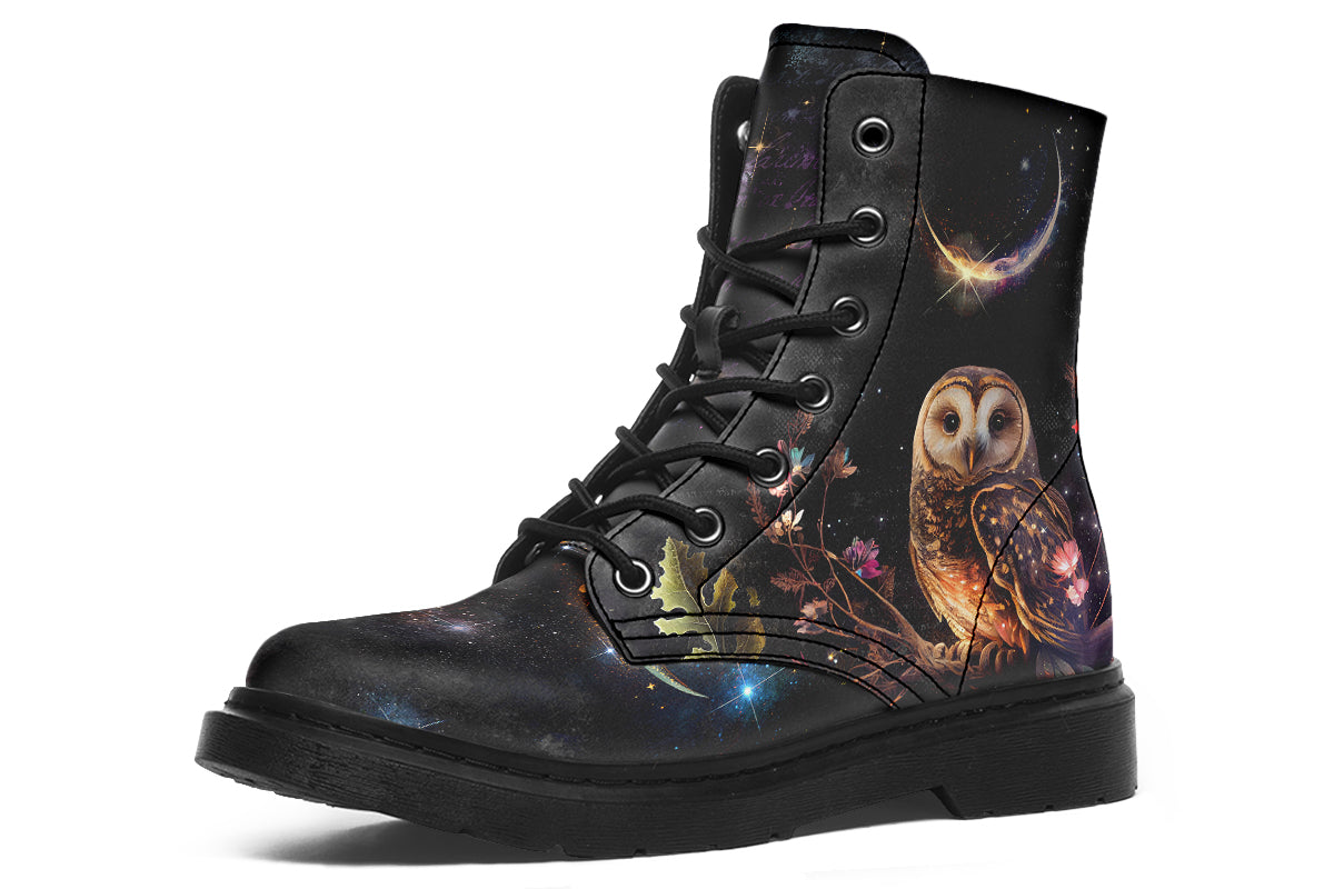Black boots with different owls on each side.