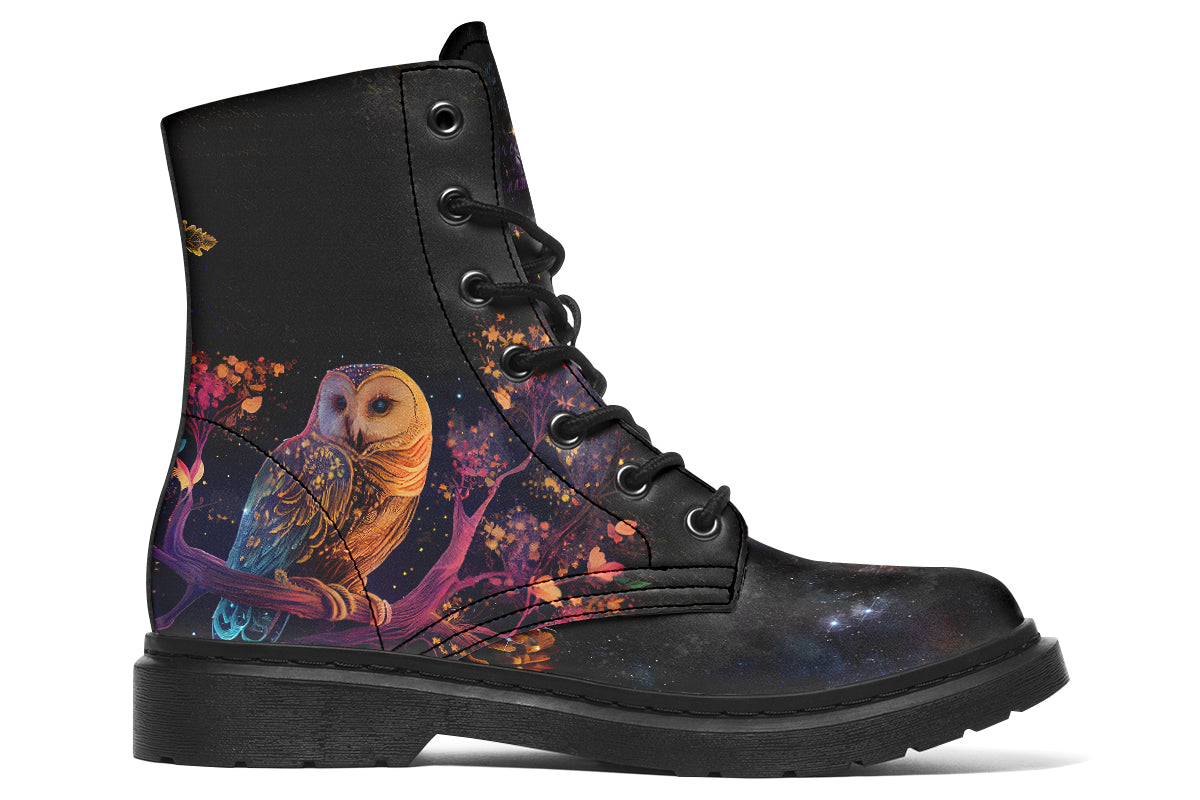 Black boots with different owls on each side.