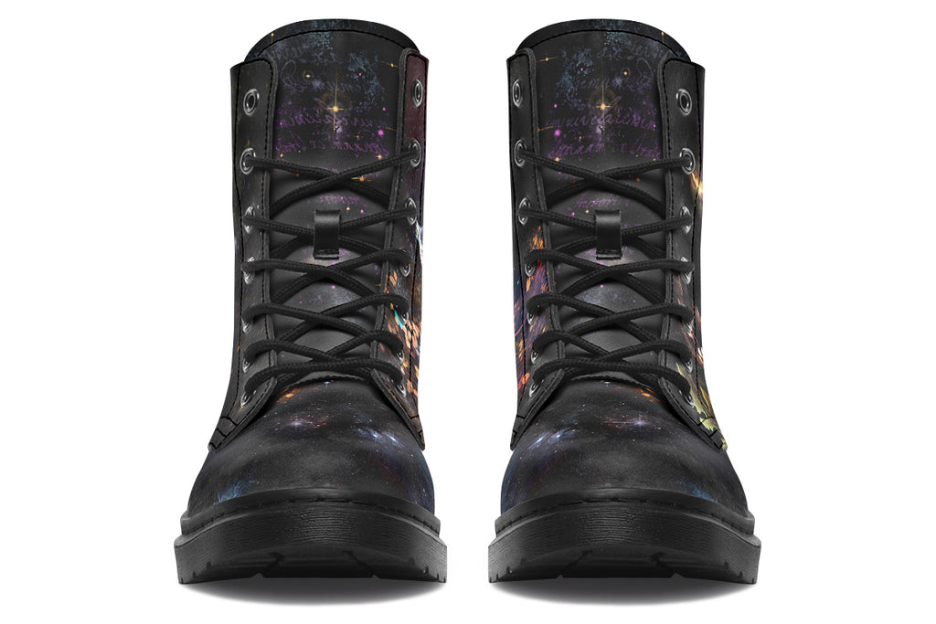 Black boots with different owls on each side.