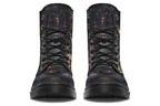 Black boots with different owls on each side.
