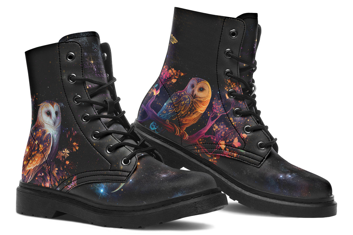 Black boots with different owls on each side.