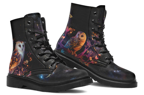 Black boots with different owls on each side.
