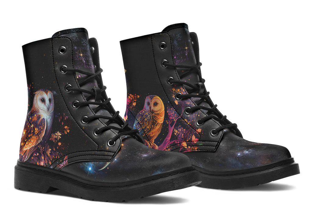 Black boots with different owls on each side.