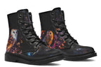 Black boots with different owls on each side.