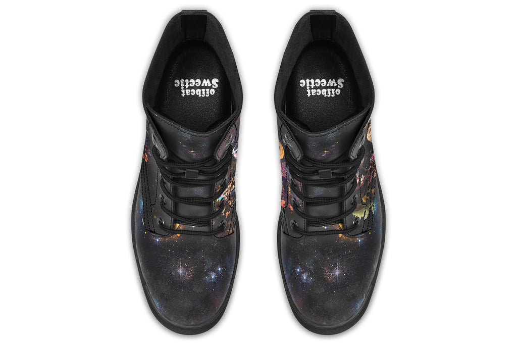 Black boots with different owls on each side.