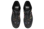 Black boots with different owls on each side.