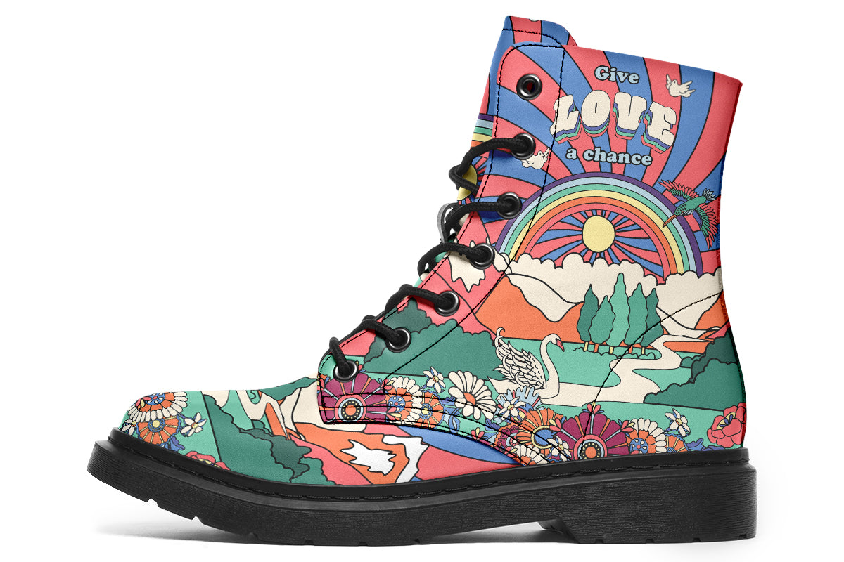 Mismatched boots with 60’s style psychedelic landscape imagery. One says “All You Need Is Peace” and the other says “Give Love A Chance”