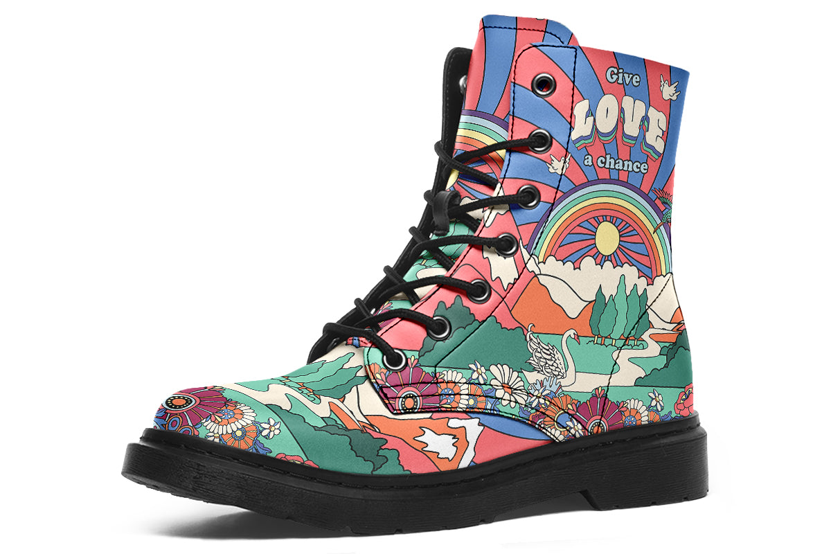 Mismatched boots with 60’s style psychedelic landscape imagery. One says “All You Need Is Peace” and the other says “Give Love A Chance”