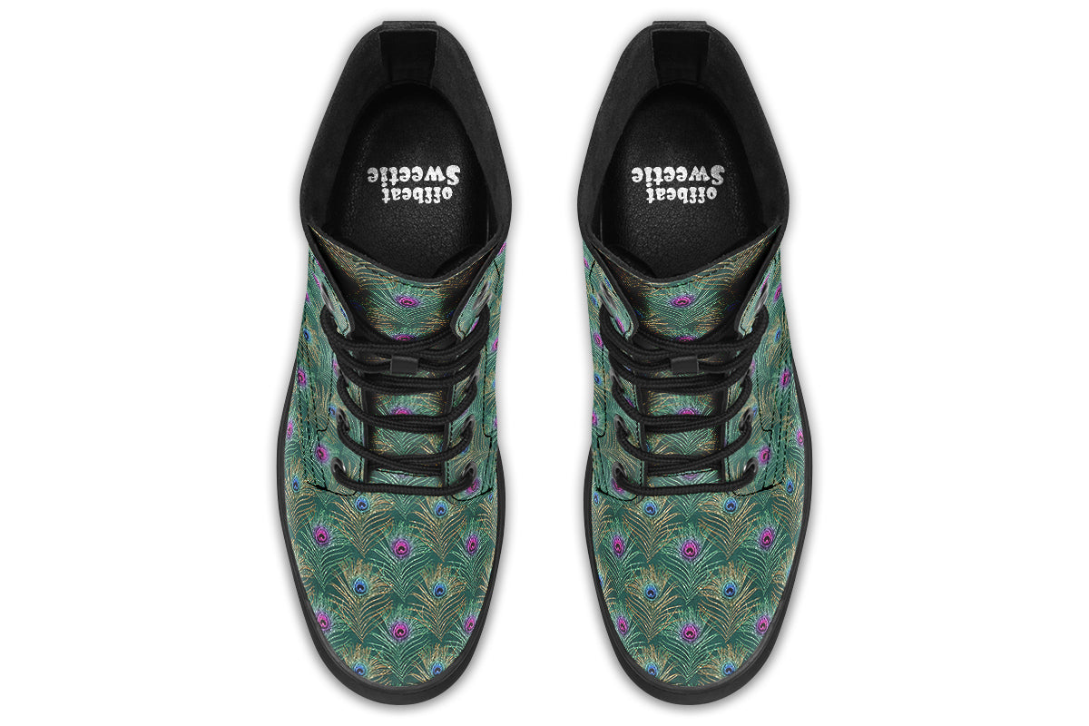 Boots featuring a green peacock feather design. The feathers have pink or blue accents.