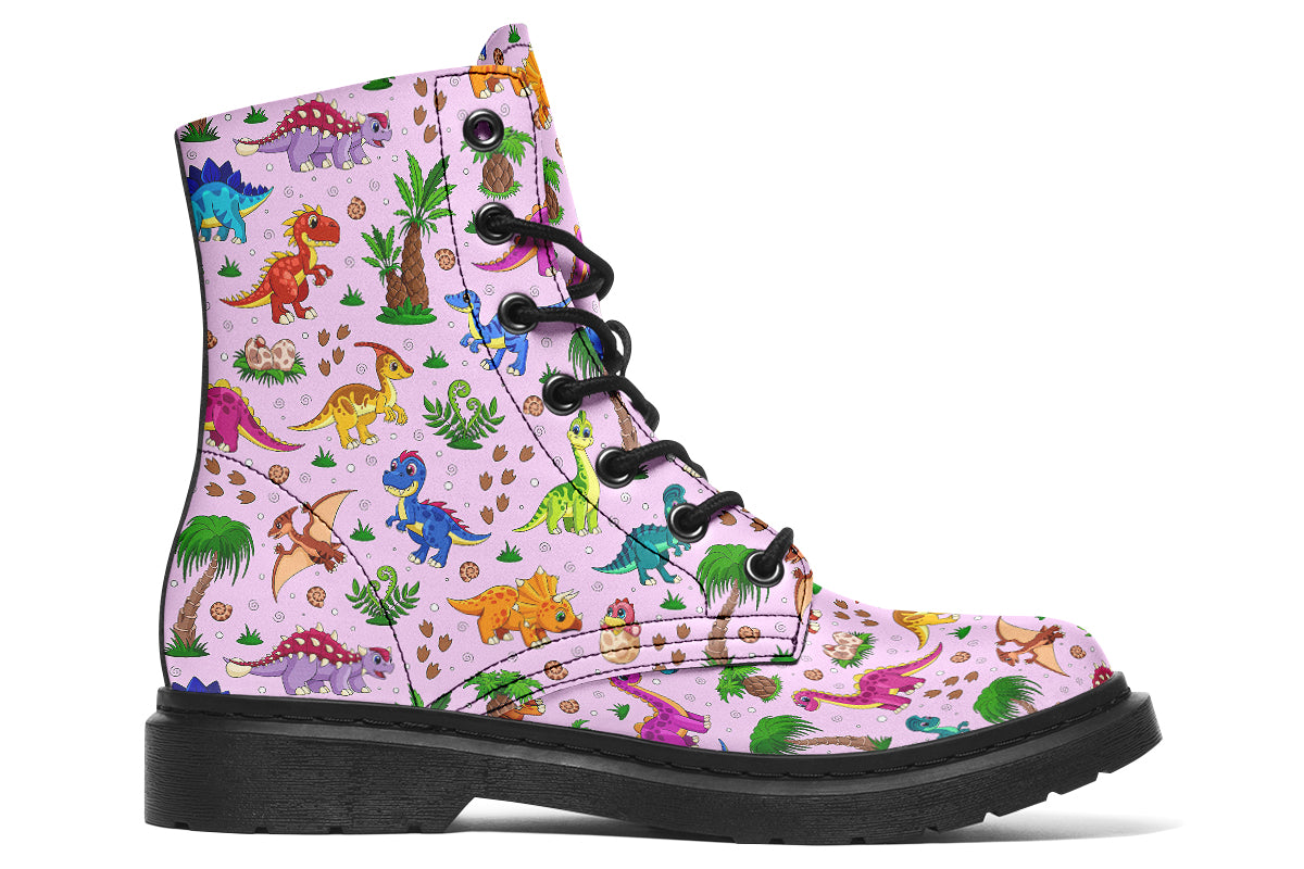 Mismatched boots, one light blue, one light pink, each with a pattern of different coloured cute baby dinosaurs, prehistoric-looking trees and dinosaur eggs
