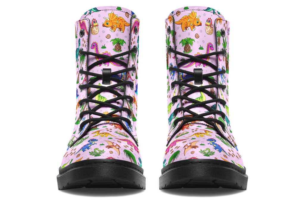 Light pink boots with a pattern of different coloured cute baby dinosaurs, prehistoric-looking trees and dinosaur eggs