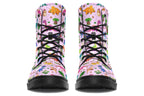 Light pink boots with a pattern of different coloured cute baby dinosaurs, prehistoric-looking trees and dinosaur eggs