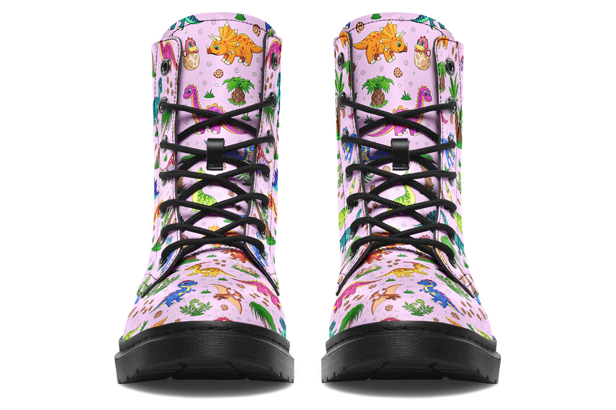 Light pink boots with a pattern of different coloured cute baby dinosaurs, prehistoric-looking trees and dinosaur eggs