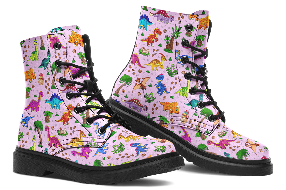 Light pink boots with a pattern of different coloured cute baby dinosaurs, prehistoric-looking trees and dinosaur eggs