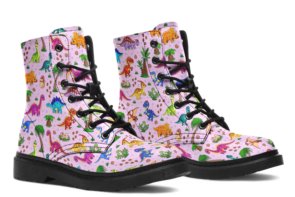 Light pink boots with a pattern of different coloured cute baby dinosaurs, prehistoric-looking trees and dinosaur eggs