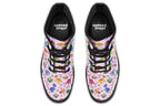 Light pink boots with a pattern of different coloured cute baby dinosaurs, prehistoric-looking trees and dinosaur eggs