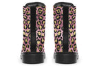 Boots with a textured-looking blush pink background and gold leopard prints