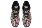 Boots with a textured-looking blush pink background and gold leopard prints