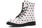 White boots with a black and red pattern of diamonds, hearts, clubs and spades.