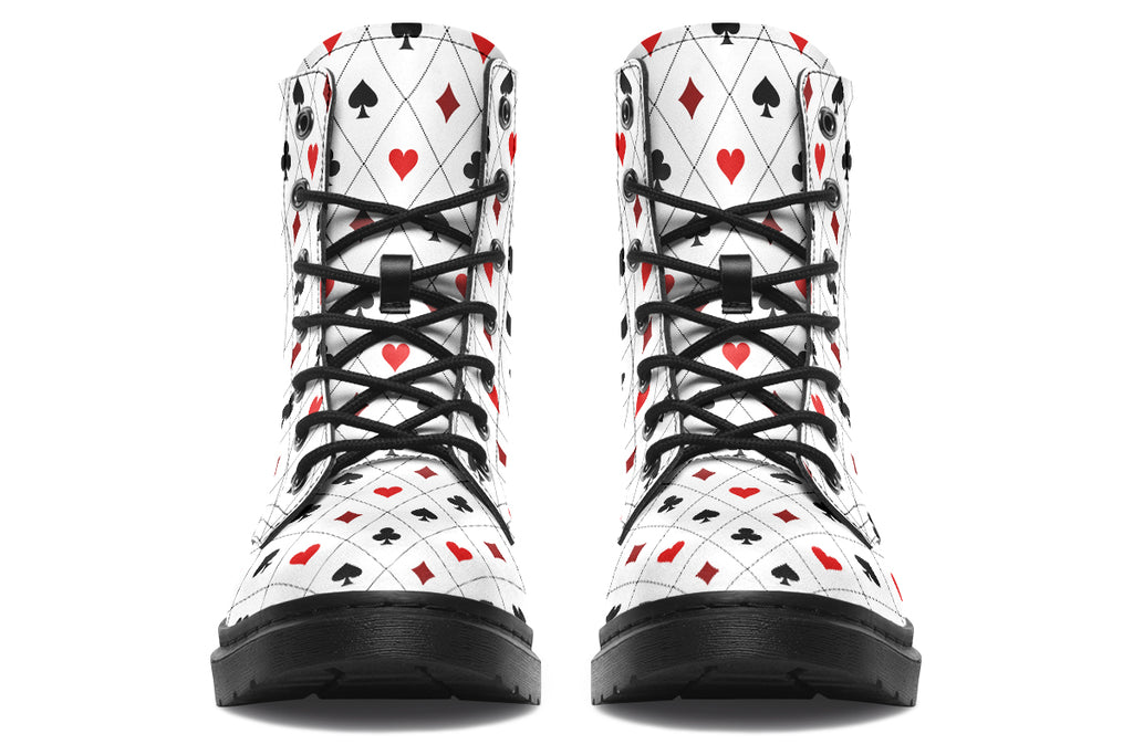 White boots with a black and red pattern of diamonds, hearts, clubs and spades.