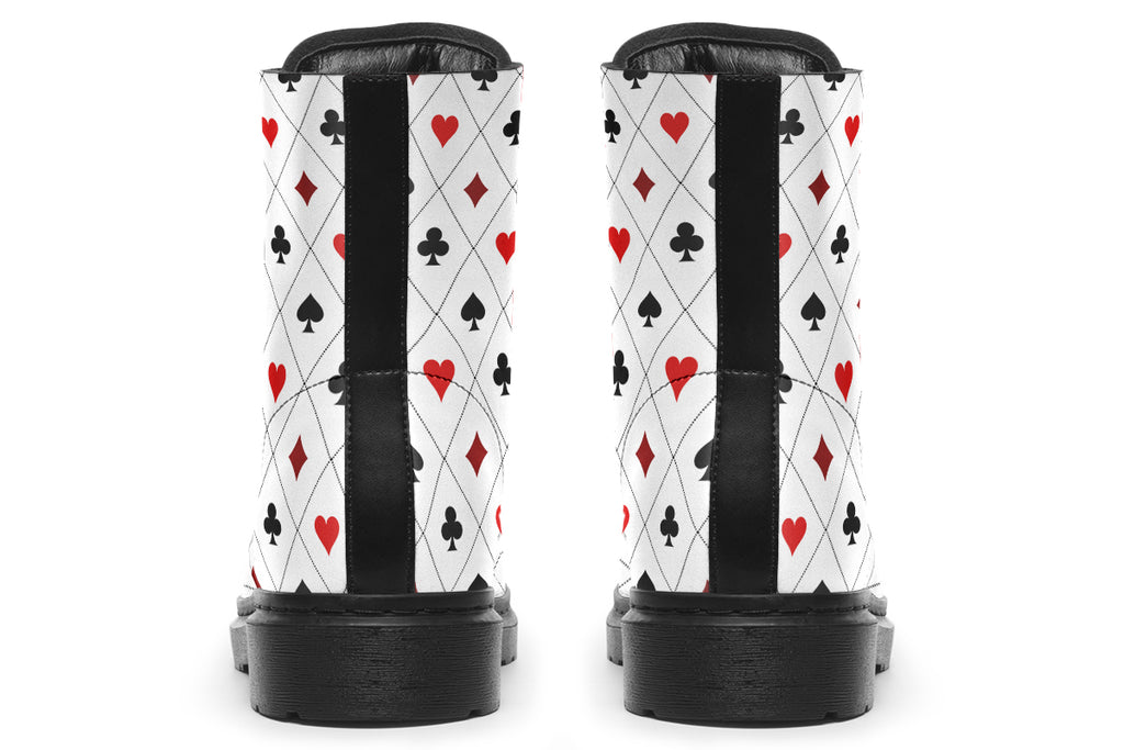 White boots with a black and red pattern of diamonds, hearts, clubs and spades.
