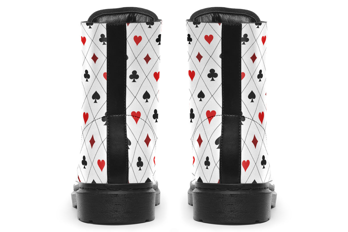 White boots with a black and red pattern of diamonds, hearts, clubs and spades.