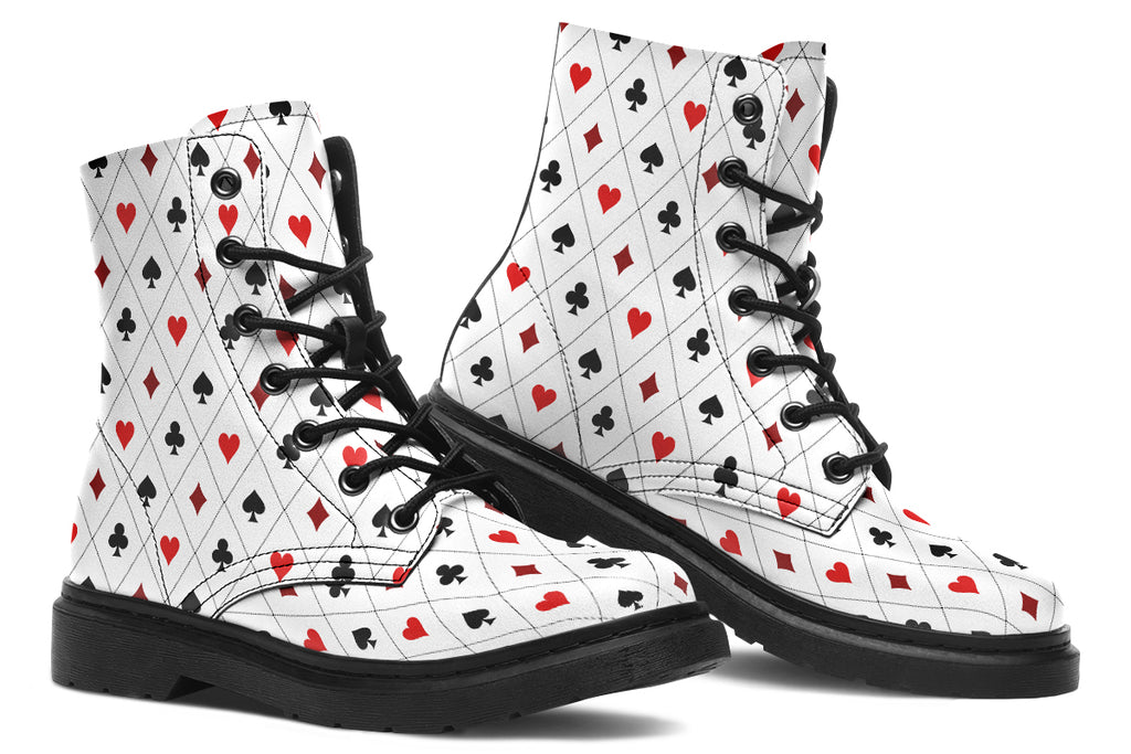 White boots with a black and red pattern of diamonds, hearts, clubs and spades.