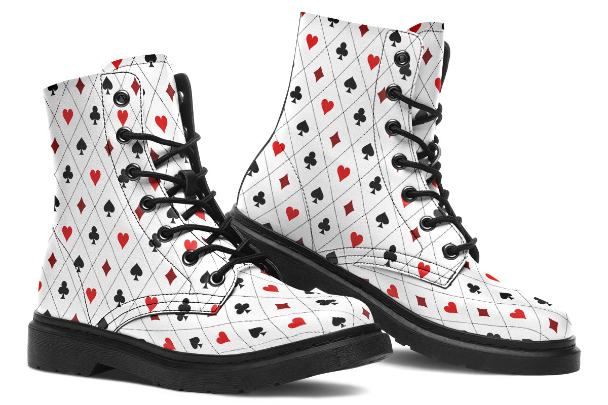 White boots with a black and red pattern of diamonds, hearts, clubs and spades.