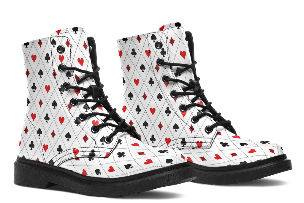 White boots with a black and red pattern of diamonds, hearts, clubs and spades.