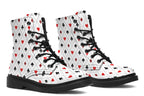 White boots with a black and red pattern of diamonds, hearts, clubs and spades.