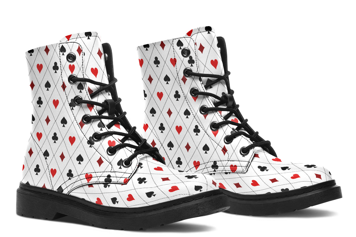 White boots with a black and red pattern of diamonds, hearts, clubs and spades.