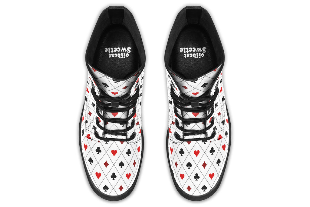 White boots with a black and red pattern of diamonds, hearts, clubs and spades.