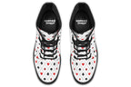 White boots with a black and red pattern of diamonds, hearts, clubs and spades.