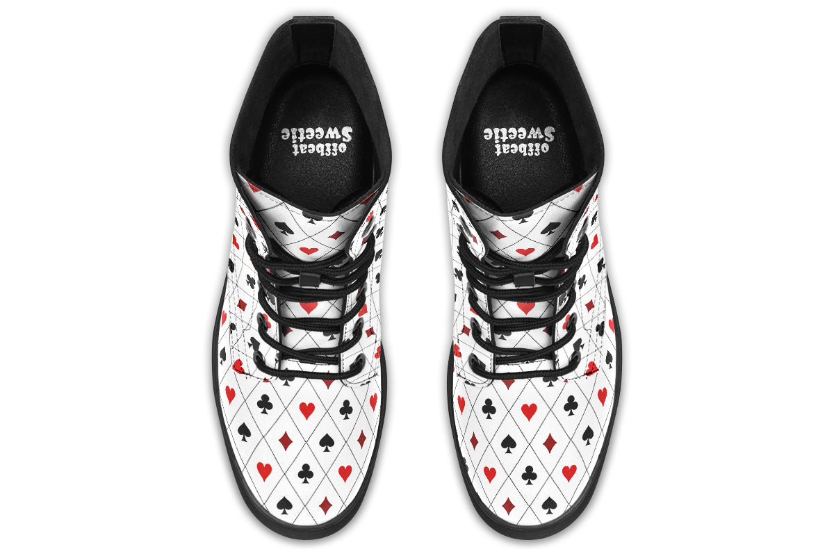 White boots with a black and red pattern of diamonds, hearts, clubs and spades.