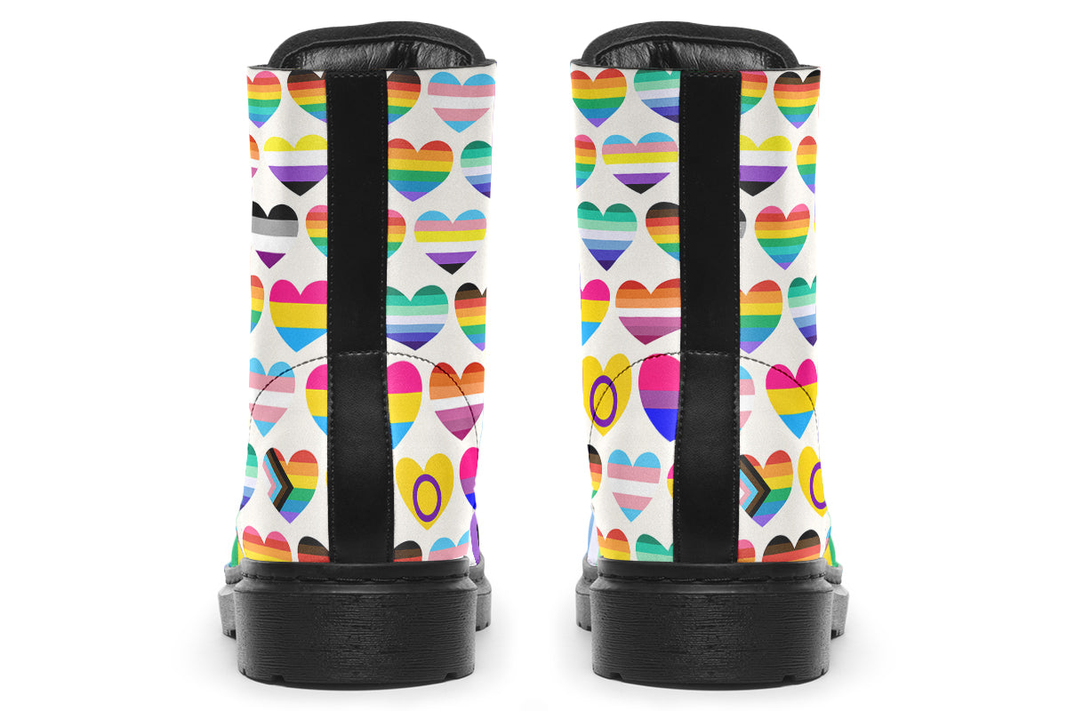 White boots with a pattern of different pride flags in heart shapes all over the boots.