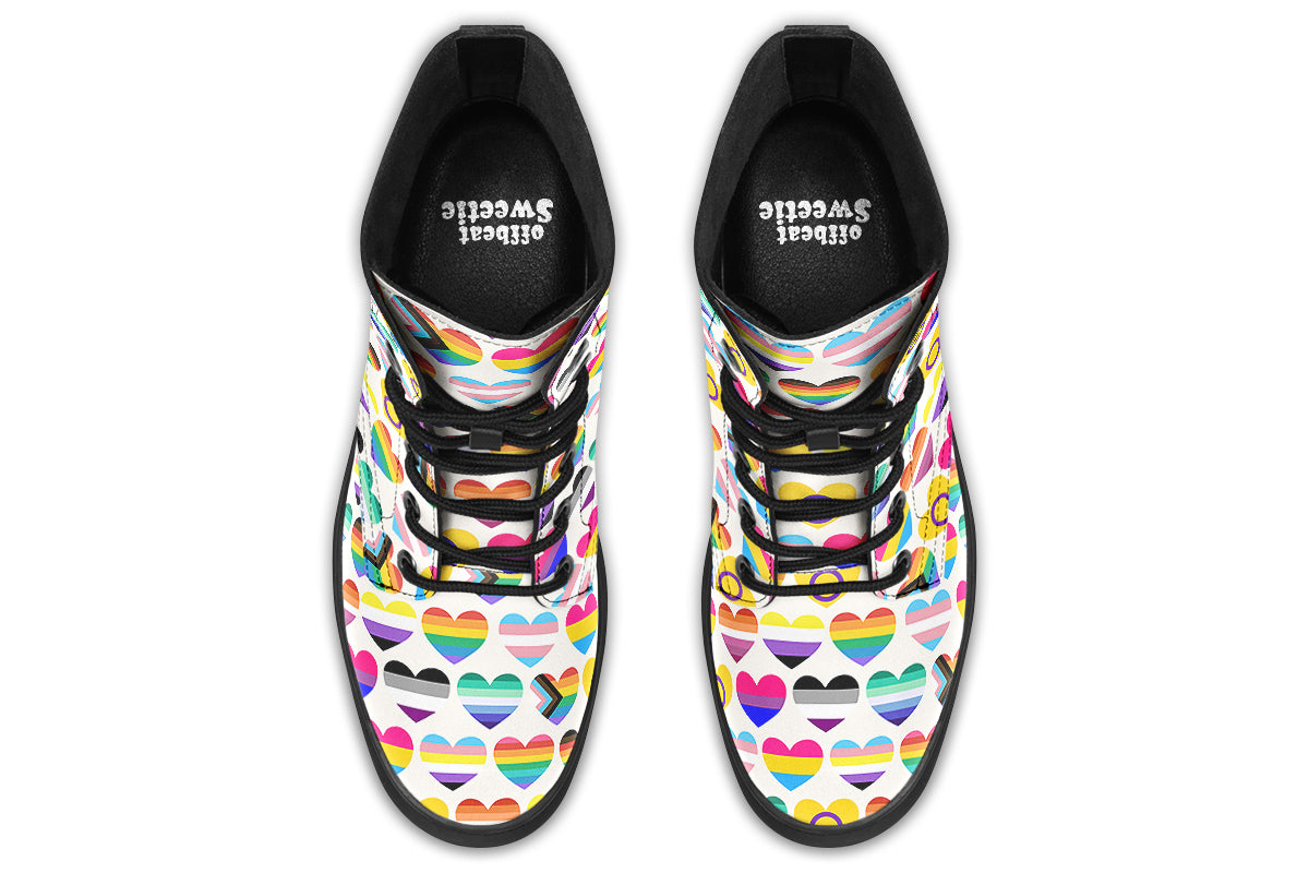 White boots with a pattern of different pride flags in heart shapes all over the boots.